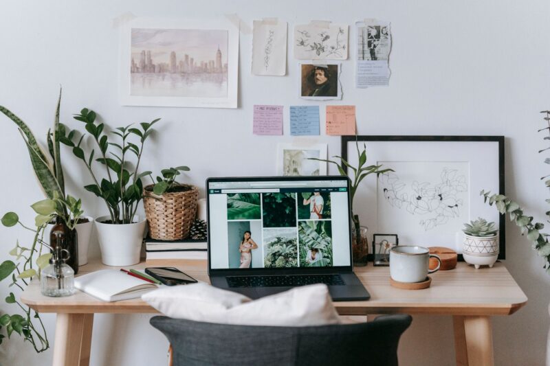 10 Realistic Ways to Turn Your Website Into an Income Stream 1 Laptop showing website analytics on a desk with a notebook and coffee cup, representing website monetization strategies